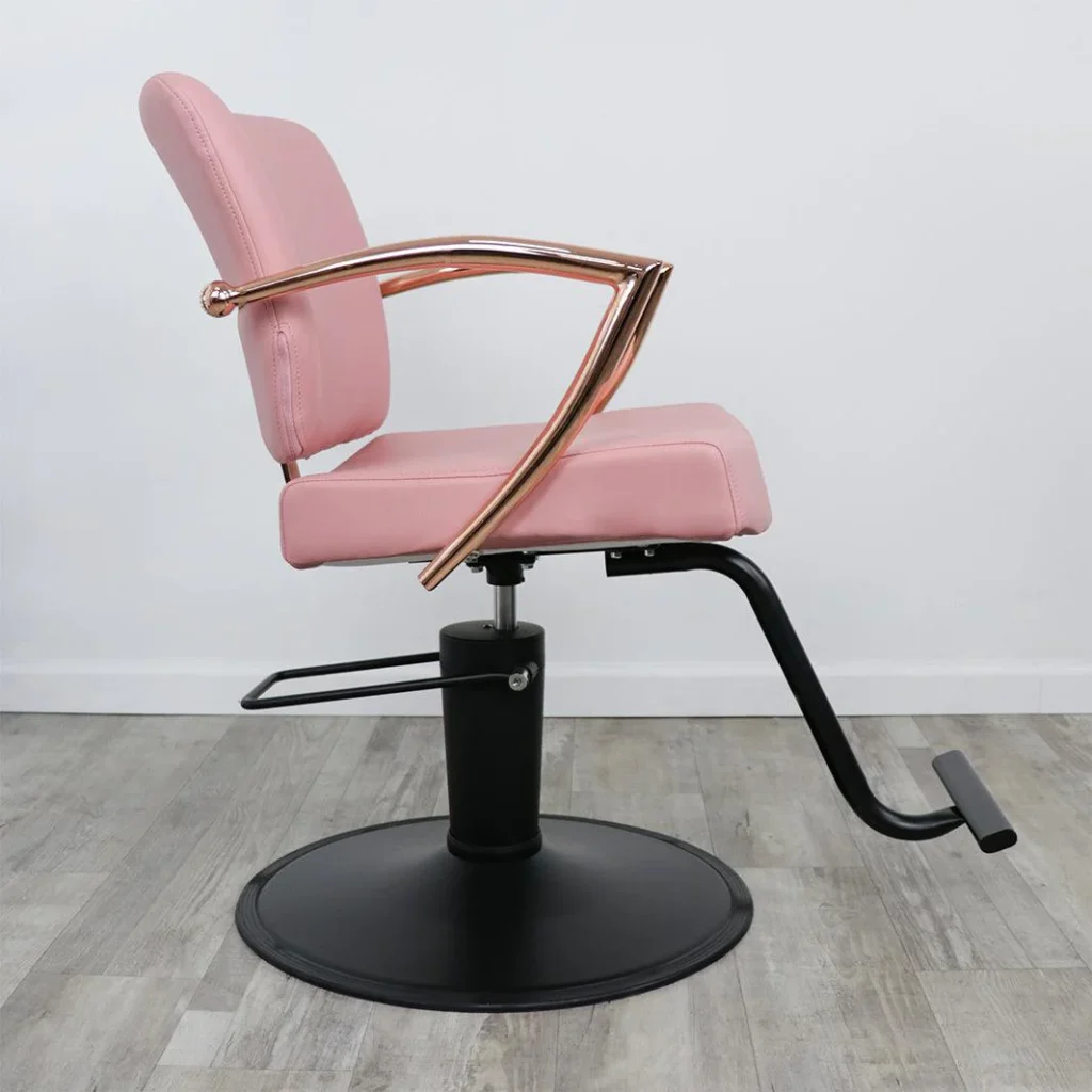 Elegant, mid-century modern beauty salon chairs in a warm, inviting setting. Plush, tufted leather upholstery in a soft, neutral palette. Sleek, chrome-finished frames with gently curved backs and armrests. Chairs arranged in a semicircle, creating an intimate atmosphere. Warm, diffused lighting from overhead fixtures casts a cozy glow. Hardwood flooring in a rich, honey tone extends into the frame. Subtle textures, such as a woven area rug and potted plants, add depth and character. The "James Barber Shop" logo subtly displayed on the chairs.