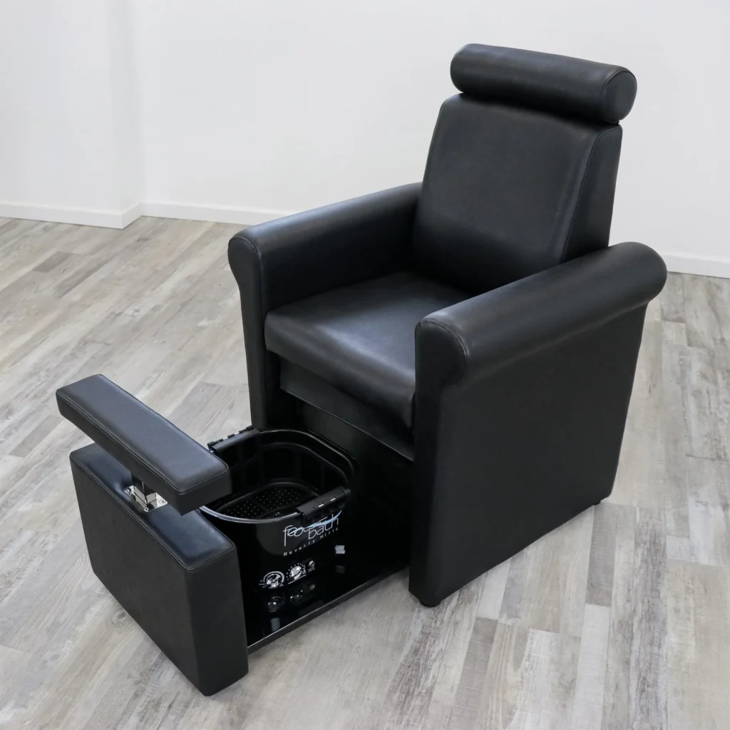 A variety of luxurious pedicure chairs in a high-end salon setting. Plush, ergonomic chairs in a range of leather tones and modern designs, arranged artfully against a backdrop of soft lighting and clean, minimalist decor. The chairs feature built-in massage functions, adjustable footrests, and a sleek, polished aesthetic that evokes a sense of relaxation and indulgence. In the foreground, a James Barber Shop branded pedicure chair takes center stage, its elegant lines and premium materials embodying the salon's commitment to excellence. The image conveys an atmosphere of sophistication and pampering, inviting the viewer to imagine experiencing the ultimate in pedicure luxury. pedicure chairs for sale