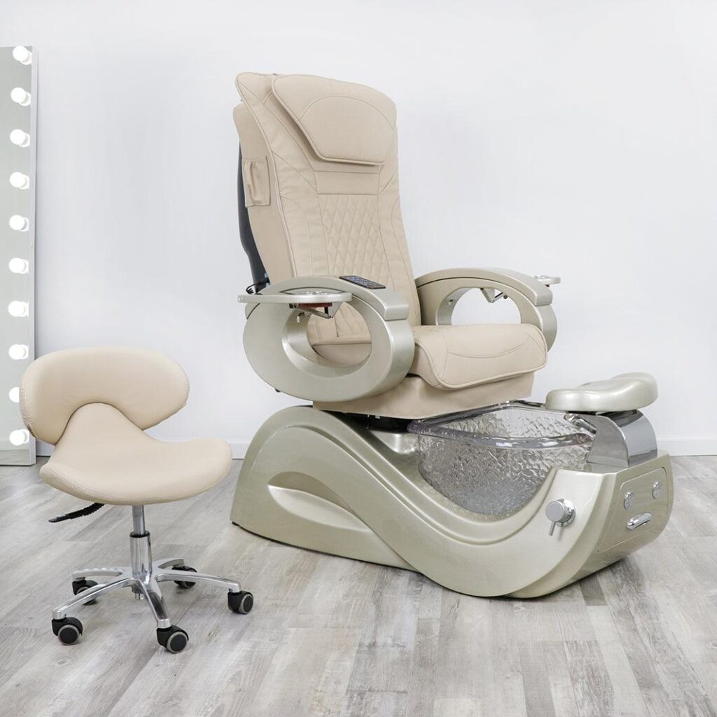 A luxurious pedicure chair in a high-end salon setting. The chair is made of rich, supple leather in a deep burgundy hue, with elegant brass accents that gleam under the warm, soft lighting. The chair is positioned in the foreground, slightly angled to showcase its streamlined design and plush, cushioned seat. In the middle ground, a marble-topped manicure table stands nearby, with a selection of premium nail care products artfully arranged. The background features a sophisticated ambiance, with a wall of soothing neutral tones and a large, ornate mirror that reflects the salon's luxurious atmosphere. The overall scene conveys a sense of indulgence and pampering, setting the stage for an exceptional pedicure experience at the James Barber Shop. pedicure chair
