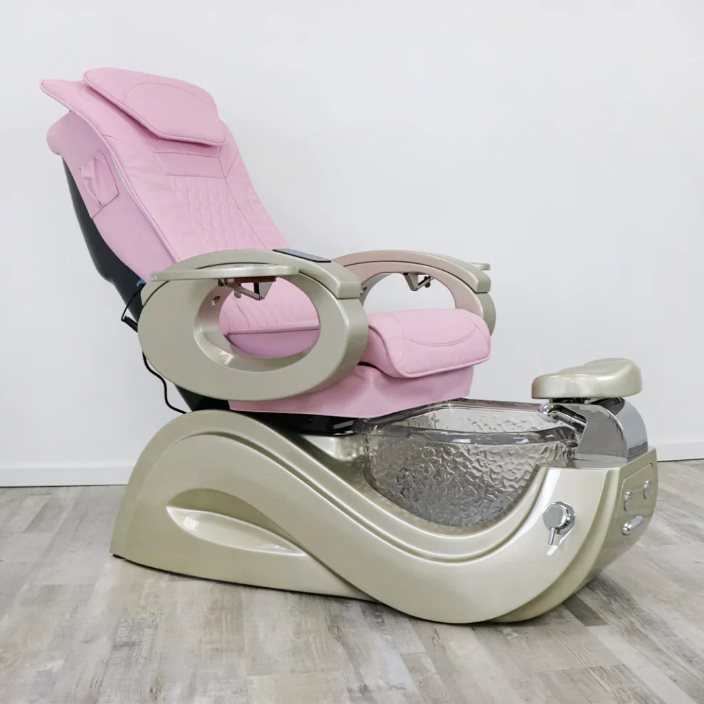 A professional pedicure chair set in a high-end salon, the "James Barber Shop". A sleek, leather-upholstered chair with a hydraulic lift and massage functionality, situated on a polished marble floor. Soft, indirect lighting creates a warm, relaxing ambiance, complemented by lush, verdant potted plants in the background. The chair is angled slightly, offering a comfortable and ergonomic position for the client's feet. The overall scene conveys a sense of luxury, sophistication, and attentive customer service.