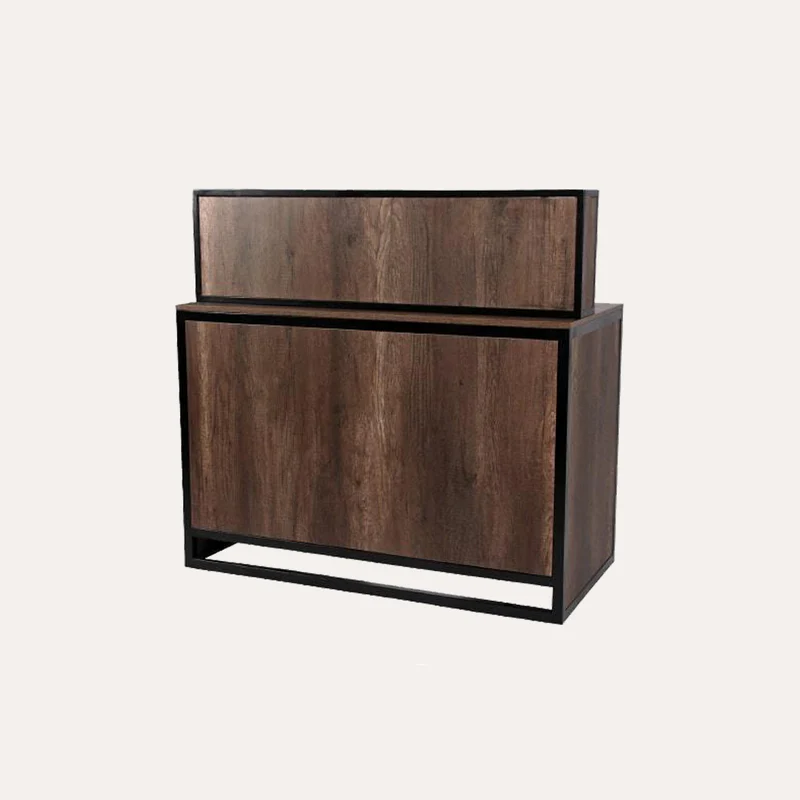 A sleek, modern reception counter with a polished wood surface and a minimalist, angular design. The counter is situated in a bright, airy space with large windows that let in natural light, creating a warm and inviting atmosphere. The counter is adorned with a small potted plant and a subtle "James Barber Shop" sign, conveying a sense of professionalism and attention to detail. The lighting is soft and diffused, creating a cohesive and visually appealing scene that reflects the importance of choosing the right style for a business's reception area.