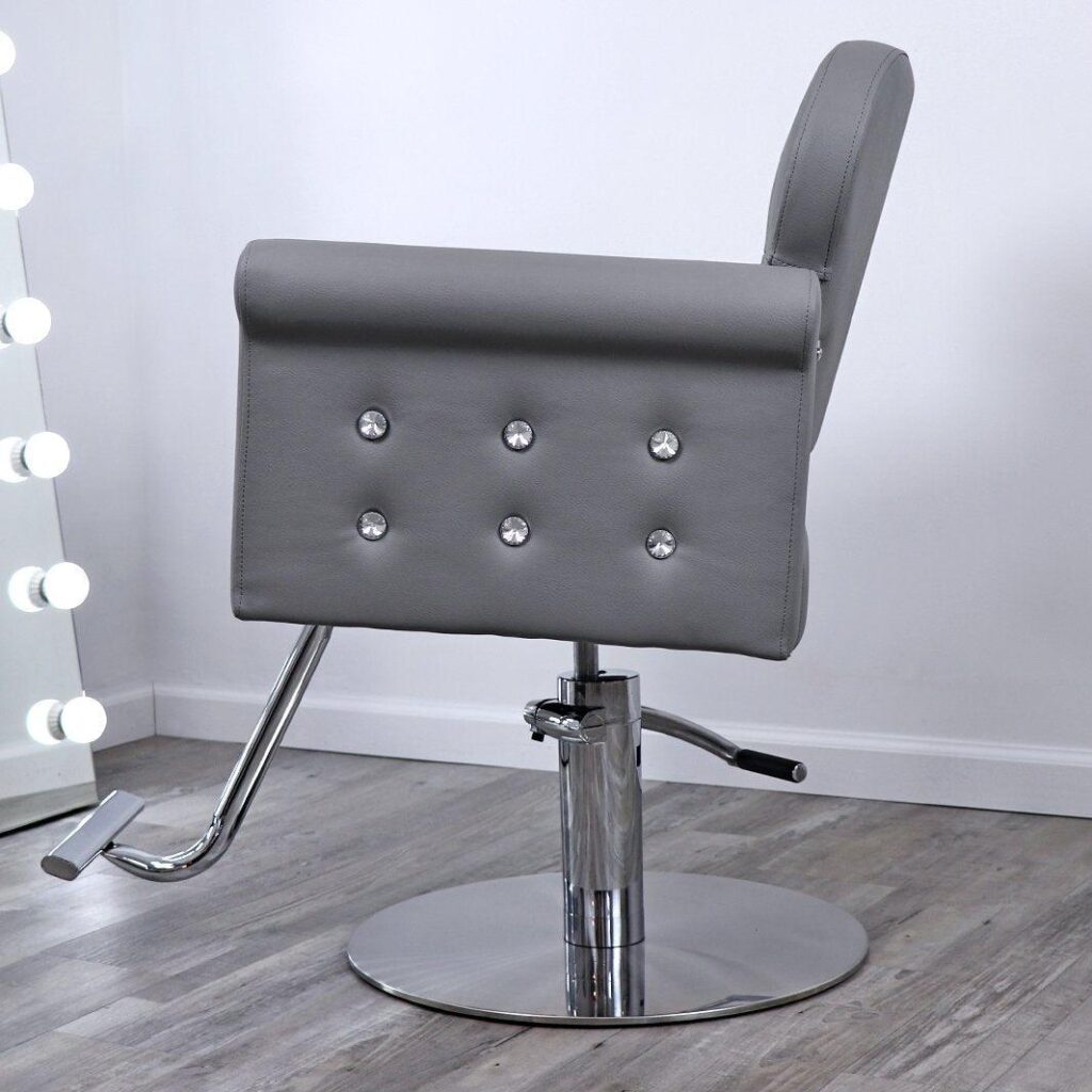 A luxurious reclining salon chair in the James Barber Shop, its plush leather upholstery gleaming under warm, focused lighting. The chair is positioned in the foreground, inviting the viewer to sink into its supportive embrace. In the middle ground, a polished hardwood floor and a tasteful wooden accent wall provide a refined, classic backdrop. The background features subtle, diffused lighting, creating a relaxing, spa-like ambiance. This is a place of respite and indulgence, where customers can unwind and experience the ultimate in comfort and pampering.