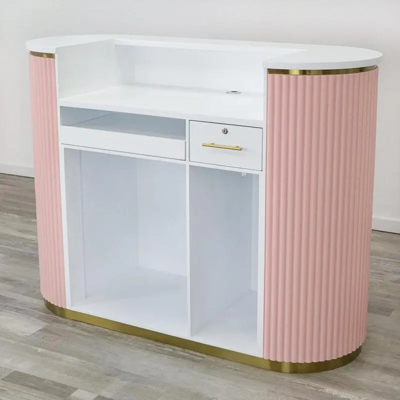 A modern, well-designed salon reception area with a sleek, rectangular reception desk made of light-colored wood or a marble-like material. The desk should have a curved front edge and a spacious top surface to accommodate a computer, phone, and other necessary equipment. Behind the desk, there is a minimalist, backlit display wall in a neutral color that adds depth and visual interest to the space. The reception area is bathed in soft, diffused lighting from overhead fixtures, creating a warm and inviting atmosphere. The floor is covered in a neutral-toned, high-quality tile or hardwood, and a few potted plants or other decor elements are strategically placed to bring a touch of nature into the space. The overall aesthetic is clean, sophisticated, and reflects the professionalism of the salon.